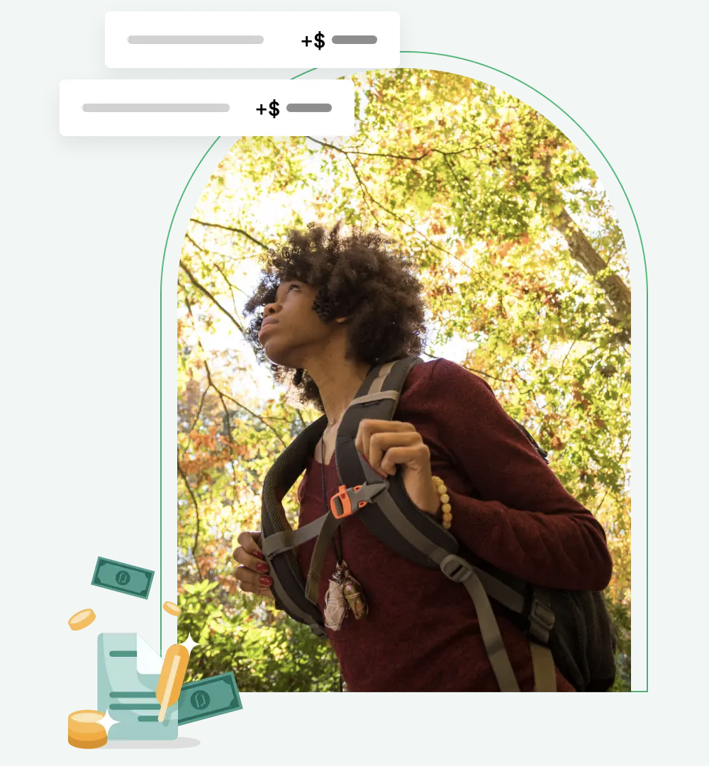 Woman with backpack looking up under trees